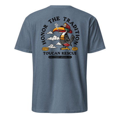 Toucan Rescue firefighter t-shirt featuring a toucan wearing a red fire helmet with Honor the Tradition artwork by Oak Street Apparel Co._heather indigo back