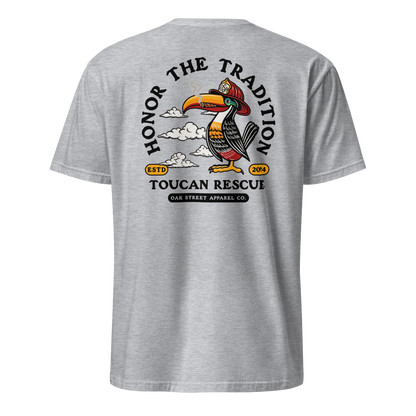 Toucan Rescue firefighter t-shirt featuring a toucan wearing a red fire helmet with Honor the Tradition artwork by Oak Street Apparel Co._sport grey back
